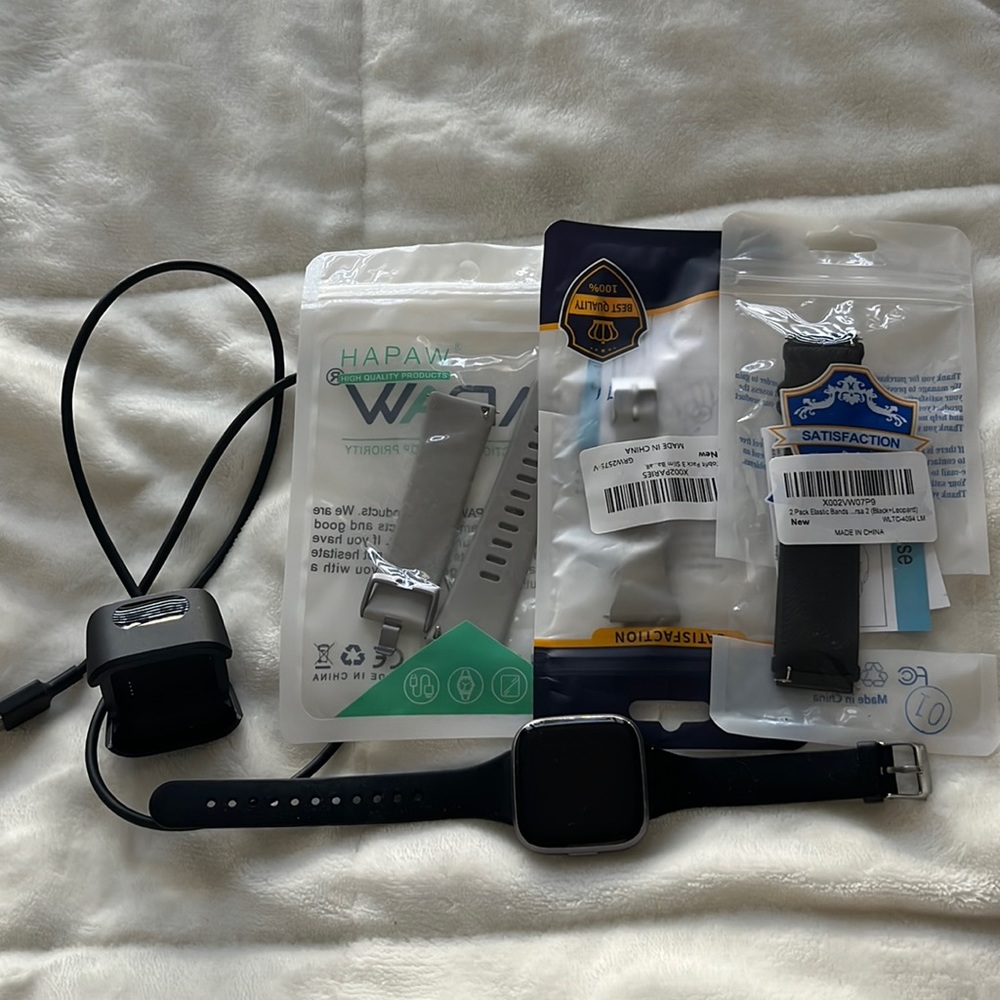 Fitbit Versa 2 with charger and bands